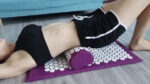 acupressure mat and pillow in use